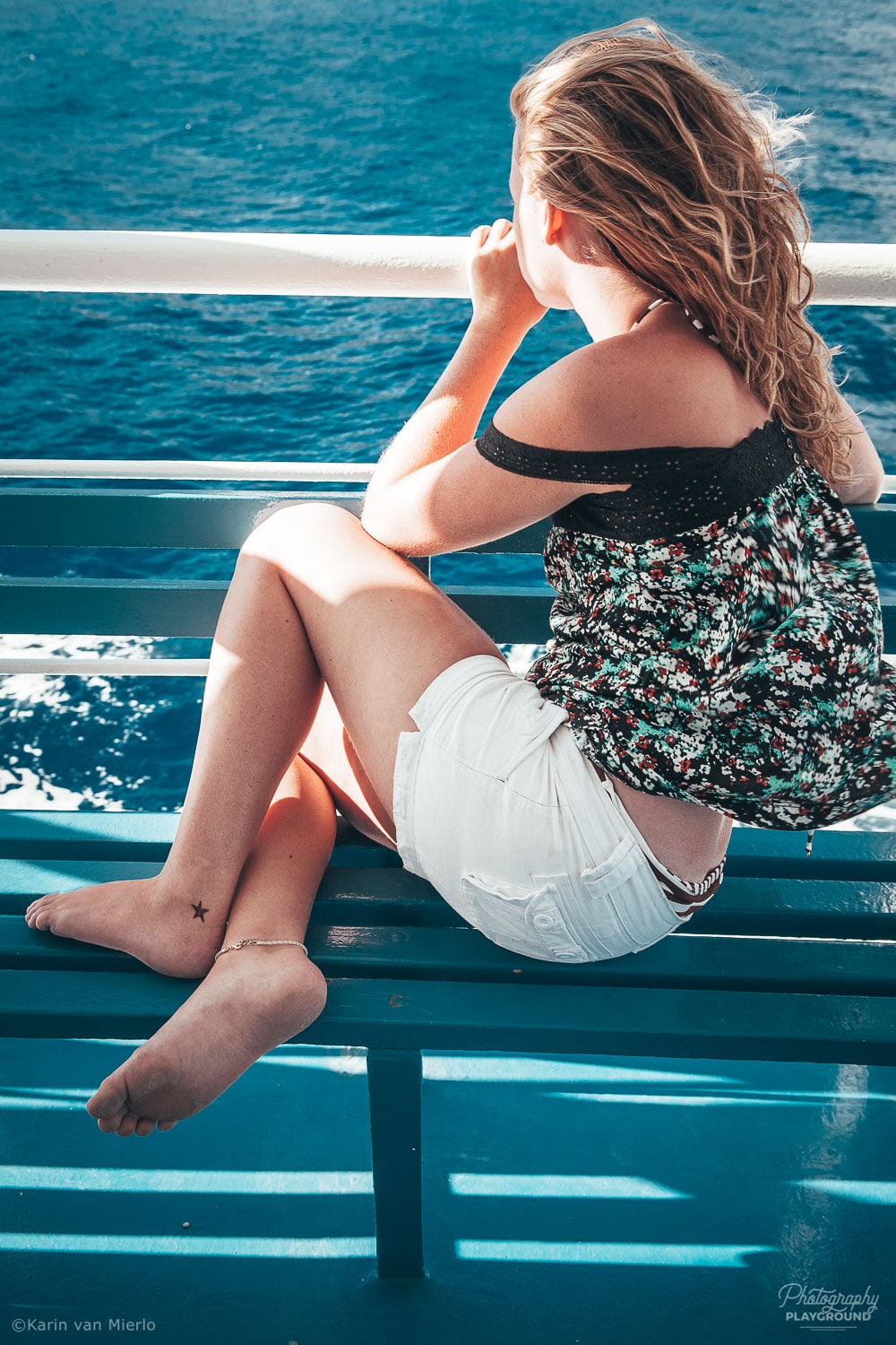 candid photography tips, people photography, candid pics | Photo: Girl on a boat, Crete, Greece ©Karin van Mierlo, Photography Playground