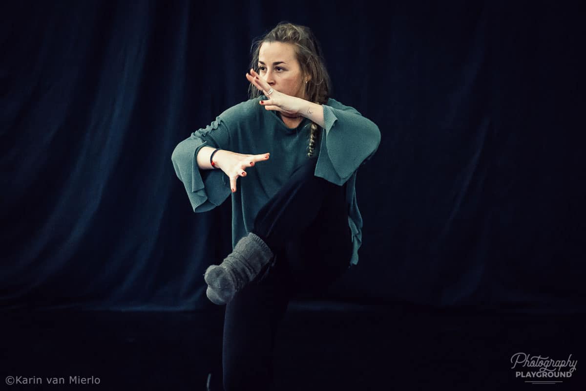 capturing motion in photography, action photography tips, camera settings for action shots, how to take good action photos, copyright Karin van Mierlo for Photography Playground. Photo:Dancer during rehearsals in a dance studio